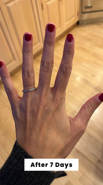 Hand shot of Allure contributing commerce editor Deanna Pai seven days after applying the Olive June Long Lasting Nail...